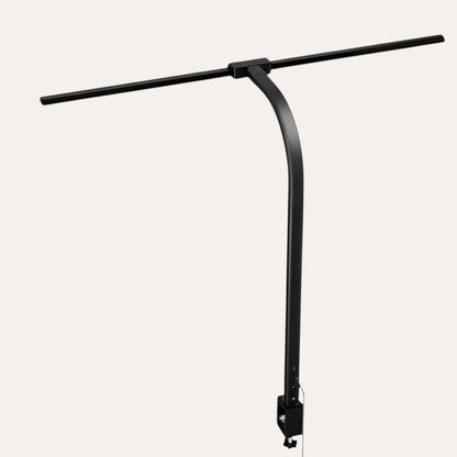 goodlampe black LED desk lamp with dual heads and clamp, flexible arm, and USB charging for phone.